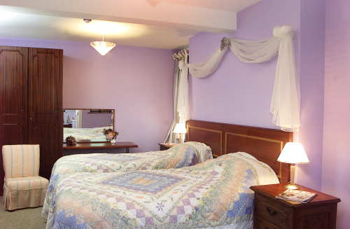 Lemnalary twin bedroom with sea views