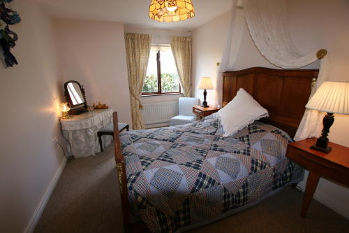 Glencloy double bedroom with views over Carnlough Bay and hills.